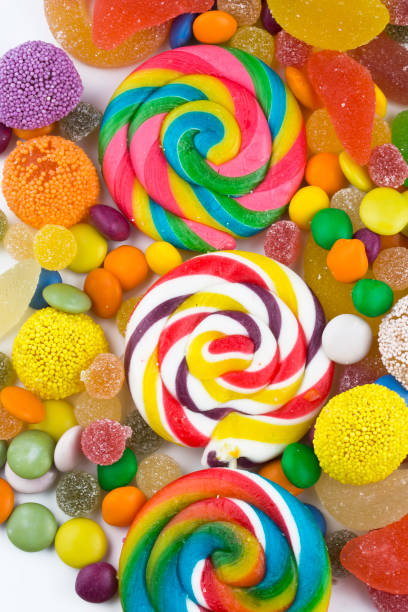 istock Colorful lollipops and different colored round candy. Top view. 1049976368