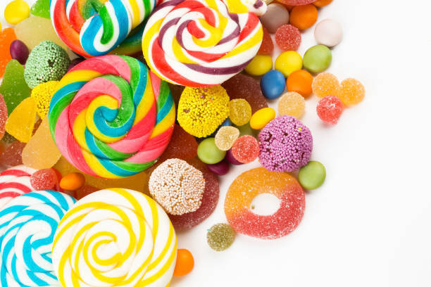 istock Colorful lollipops and different colored round candy. Top view. 1049976380