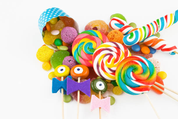 istock Colorful lollipops and different colored round candy. Top view. 1049976506