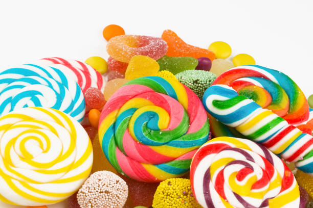 istock Colorful lollipops and different colored round candy. Top view. 1049978540