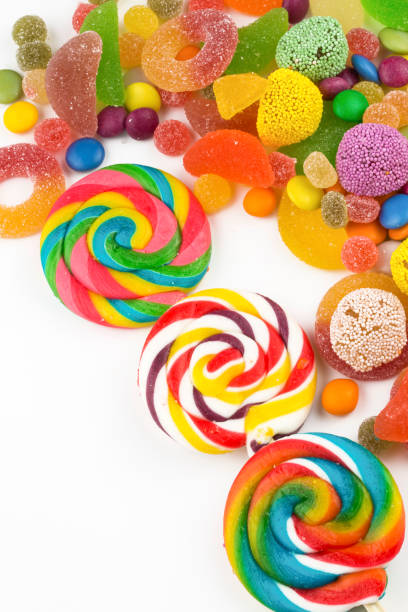 istock Colorful lollipops and different colored round candy. Top view. 1049978562