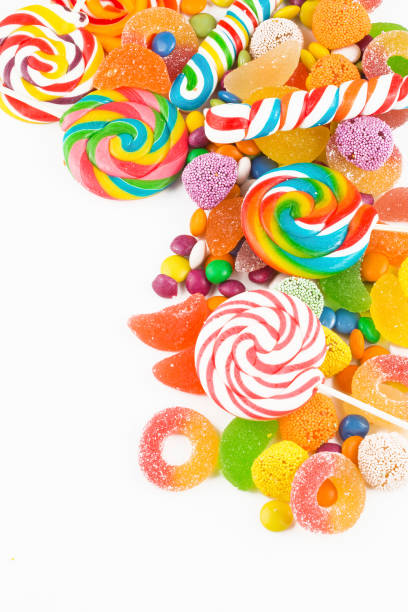 istock Colorful lollipops and different colored round candy. Top view. 1049978574