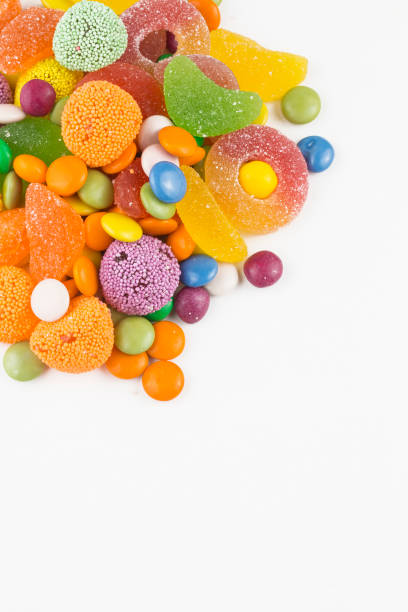 istock Colorful lollipops and different colored round candy. Top view. 1049978622