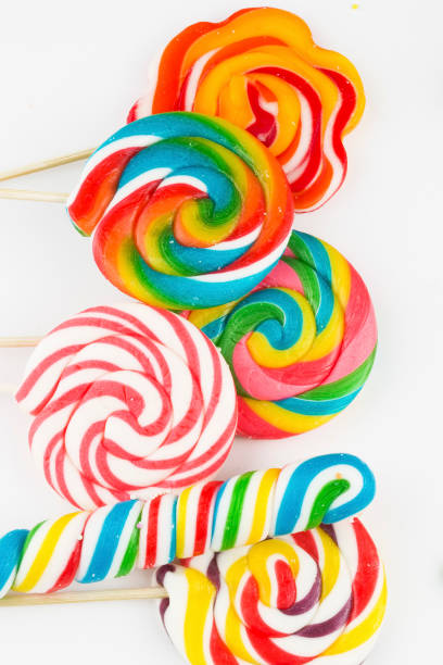 Colorful lollipops and different colored round candy. Top view.