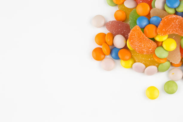 istock Colorful lollipops and different colored round candy. Top view. 1049978644