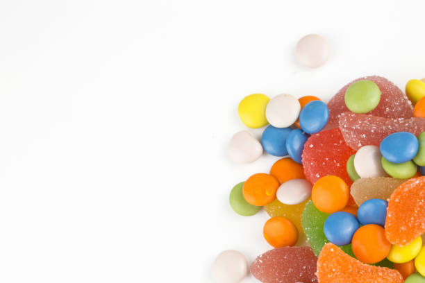 istock Colorful lollipops and different colored round candy. Top view. 1049978658