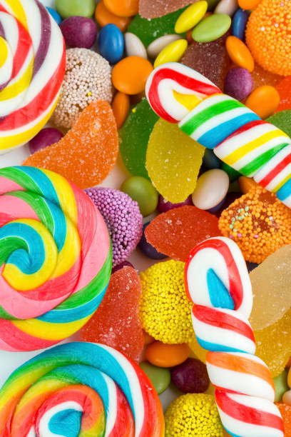 istock Colorful lollipops and different colored round candy. Top view. 1049982160