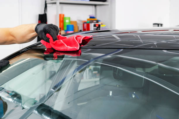 istock A man cleaning car with microfiber cloth, car detailing (or valeting) concept. Selective focus. Car detailing. Cleaning with sponge. Worker cleaning. Microfiber and cleaning solution to clean 1049982200