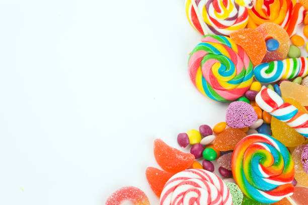 istock Colorful lollipops and different colored round candy. Top view. 1049982264