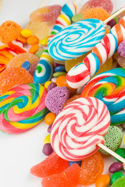 istock Colorful lollipops and different colored round candy. Top view. 1049982280