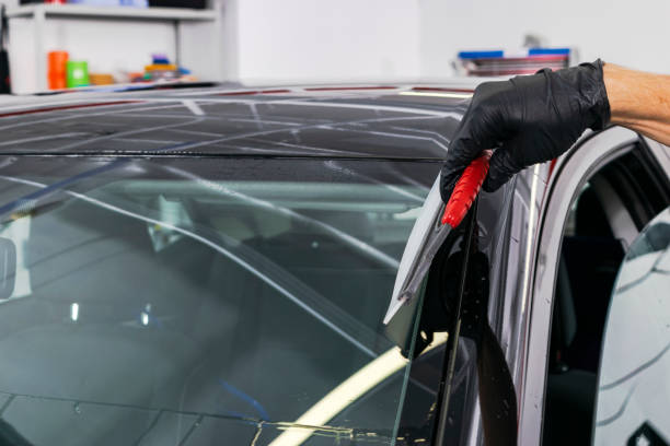 istock A man cleaning car with microfiber cloth, car detailing (or valeting) concept. Selective focus. Car detailing. Cleaning with sponge. Worker cleaning. Microfiber and cleaning solution to clean 1049982304