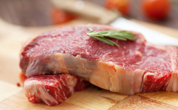 istock fresh raw meat on old wooden table 1049984590