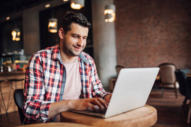 istock Man working online at a cafe 1049994456