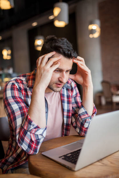 istock Man working online at a cafe 1049994498