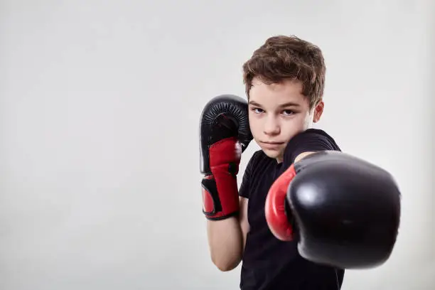 Young boy muay thai fighter in various postures