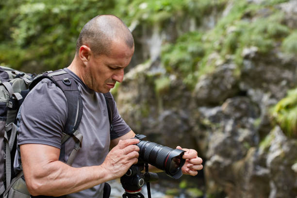 istock Photographer with camera outdoor 1049994746