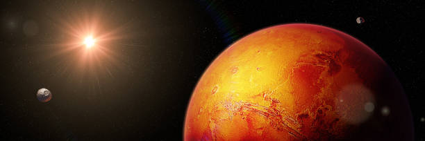 istock red planet Mars with moons Phobos and Deimos, part of the solar system 1049994860