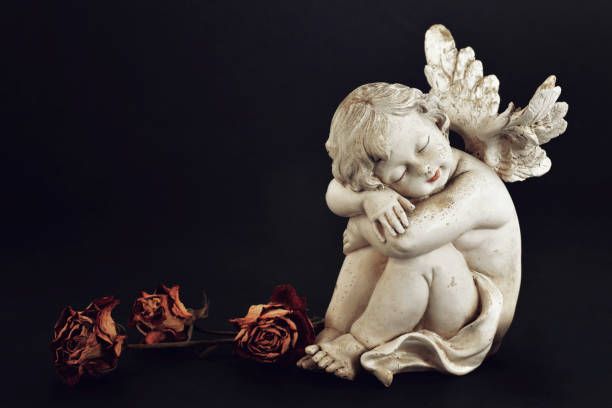 istock Little angel guardian sleeping 1049997428