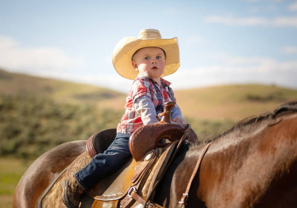 istock Little boy horseback riding 1050000768