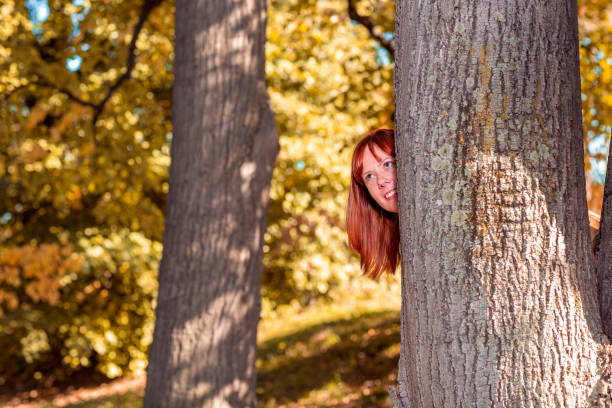istock Smiling ginger girl in nature 1050009280