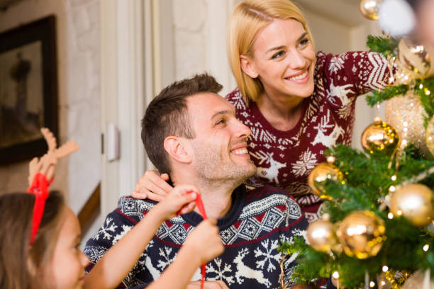 istock Family decorating Christmas tree 1050013110