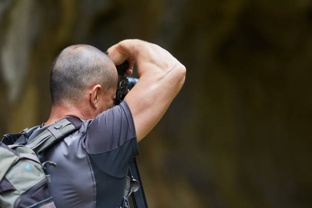 istock Photographer with camera outdoor 1050013440