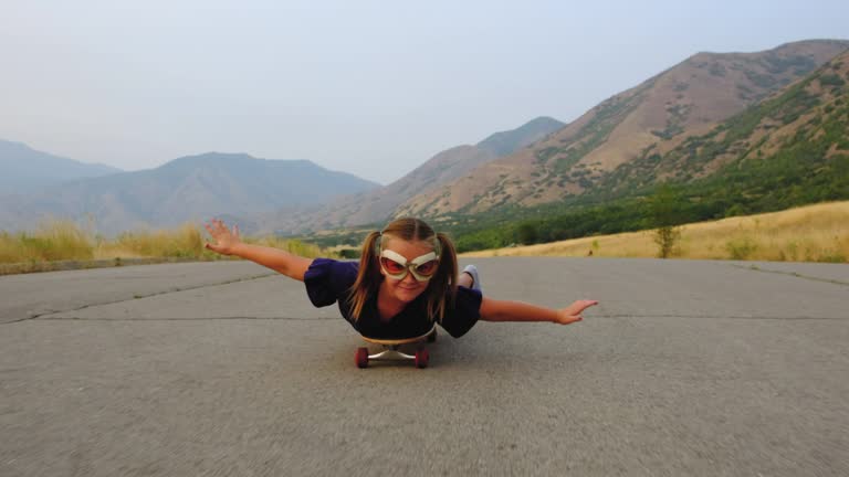 Young Girl Riding on Skateboard