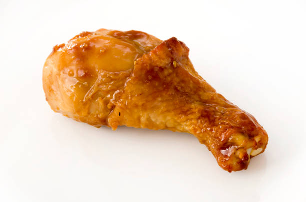 istock roasted chicken leg on white background 1050024316