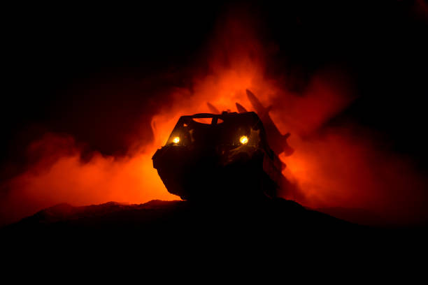 istock Rocket launch with fire clouds. Battle scene with rocket Missiles with Warhead Aimed at Gloomy Sky at night. Rocket vehicle on War Backgound 1050027090
