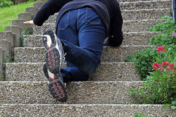 istock A woman slipped on a staircase and fell down 1050029546