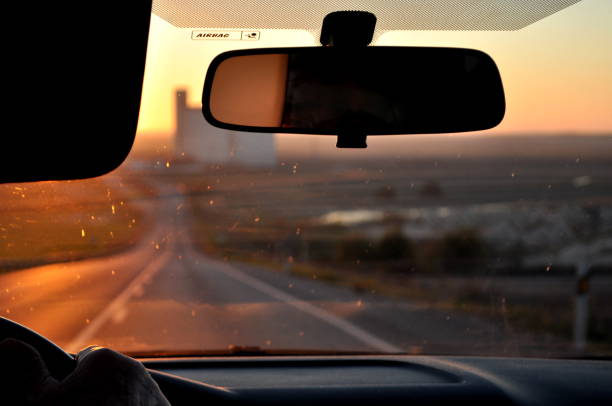 The old road, the sunset, the car... brings the sense of driving far, going somewhere or just like the song \
