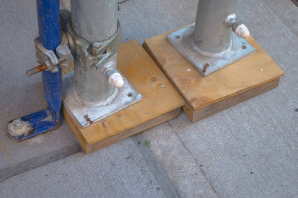 istock leveling off construction scaffolding with wood pegs and nails 1050041062