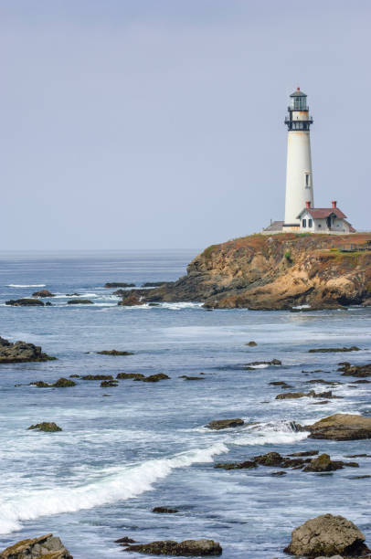 istock Pacific Coast Lighthouse and Rocky Shore 1050041180