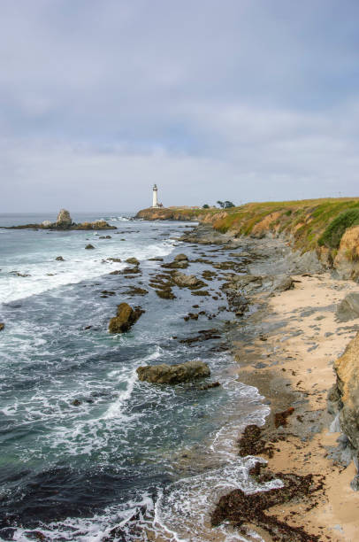 istock Pacific Coast Lighthouse and Rocky Shore 1050043602