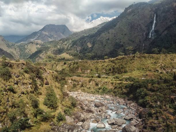 Kagbeni / Nepal - OCT 22 2016: Gorge of the Kali Gandaki river with high cliffs and the valley with a waterfall