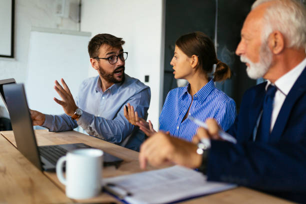 istock Three business people sitting and discussing 1050061044