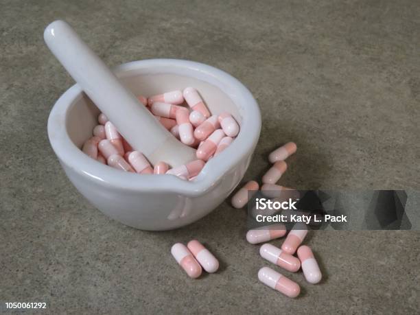 Capsules In Mortar Stock Photo - Download Image Now - Pharmaceutical Compounding, Pharmacy, Mortar and Pestle