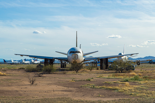 This is a shot at the Pinal Airpark between Phoenix and Tucson.  This place is part airport and part boneyard for old commercial jetliners.  Some of the planes are in working condition and just waiting to be put in service and others are like this plane with its engines and landing gear removed.  Just a shell of aluminum sitting on some old pallets and baking in the Arizona sun.