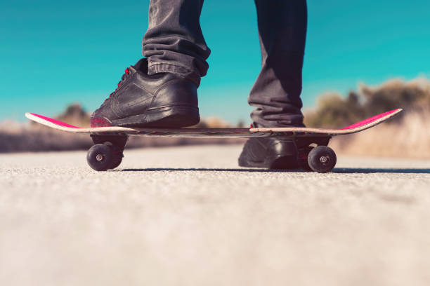 istock Skater standing on skateboard 1050072434