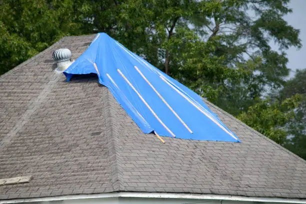 Damaged roof with bad shingles
