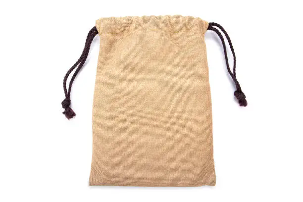 Photo of Brown sack drawstring bag packaging isolated on white background. Drawstring bag isolated