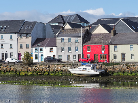 Galway, Ireland - August 3, 2018: View from the Claddagh Basin, across the River Corrib, towards the street known as The Long Walk in Galway, Ireland.