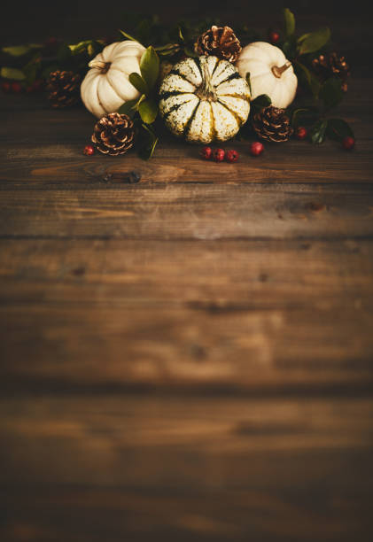 istock Thanksgiving background with pumpkin variety and berries 1050116792