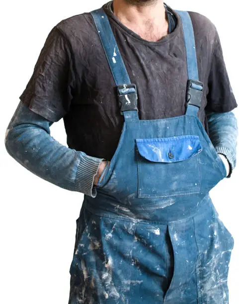 Isolated dirty uniform or boilersuit - working dress of house-painter in house is under construction, remodeling, renovation, extension, overhaul, restoration and reconstruction.