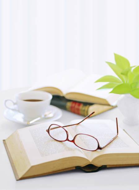 istock book and glasses  and coffee 1050127808