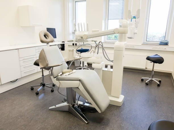 istock dentist office. Interior of a dentist's office and special equipment 1050130298