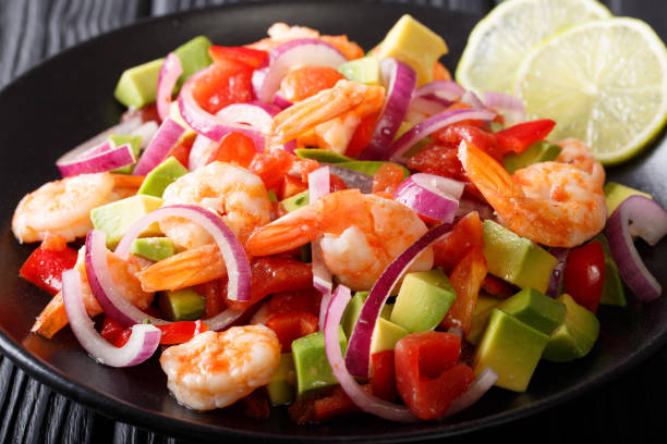 istock Latin American ceviche seafood with vegetables and lime close up on a plate. horizontal 1050143852