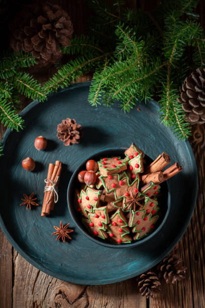 istock Gingerbread cookies in the shape of Christmas tree with pinecone 1050152012