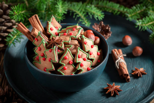 istock Sweet gingerbread cookies for Christmas on rustic tray 1050152324