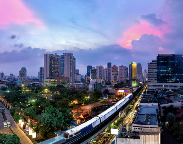 istock Bangkok business district with the sky train in the foreground along twilight. 1050154352